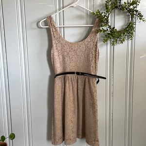 Small tan dress with black belt.